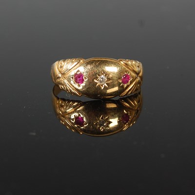 Lot 86 - An 18ct gold, ruby and diamond three stone...