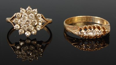 Lot 92 - An 18ct gold dress ring set with four...