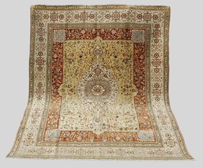 Lot 114 - A Persian Heriz carpet, the ochre coloured...