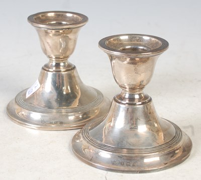 Lot 132 - A pair of Birmingham silver table candlesticks,...