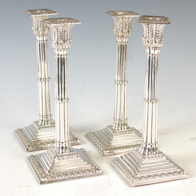 Lot 135 - A set of four electroplated candlesticks, each...