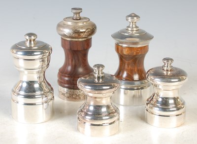 Lot 136 - A collection of five pepper mills to a...