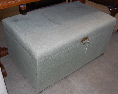 Lot 721 - A green upholstered ottoman with brass handle