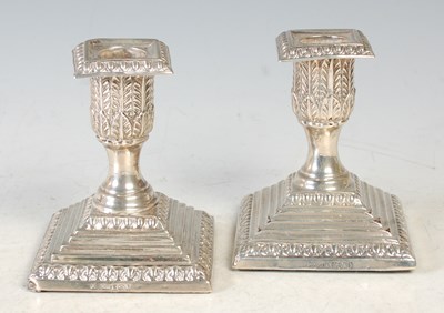 Lot 187 - A pair of Sheffield silver candlestands, the...