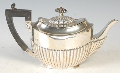 Lot 195 - A London silver bachelors teapot, oval shaped...