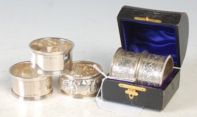 Lot 203 - A group of silver napkin rings to include a...