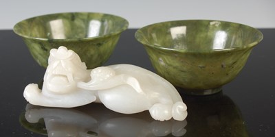 Lot 215 - A Chinese pale celadon jade carving of a...