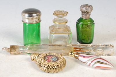 Lot 244 - A collection of glass scent bottles to include...