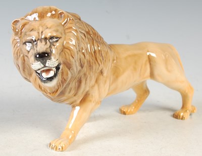 Lot 269 - A Beswick model of a lion, 14cm high.