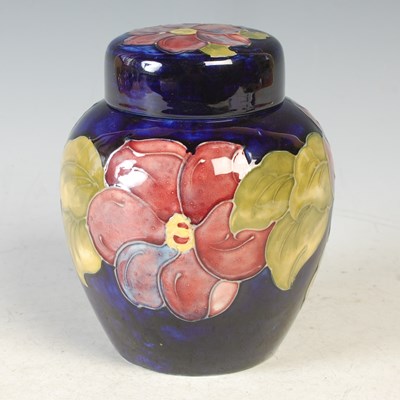 Lot 278 - Clematis, a Moorcroft blue ground jar and...