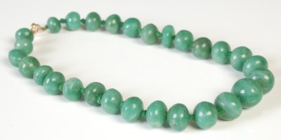 Lot 299 - A vintage graduated green stone bead necklace,...