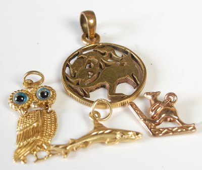 Lot 307 - A collection of charms to include a 9ct gold...