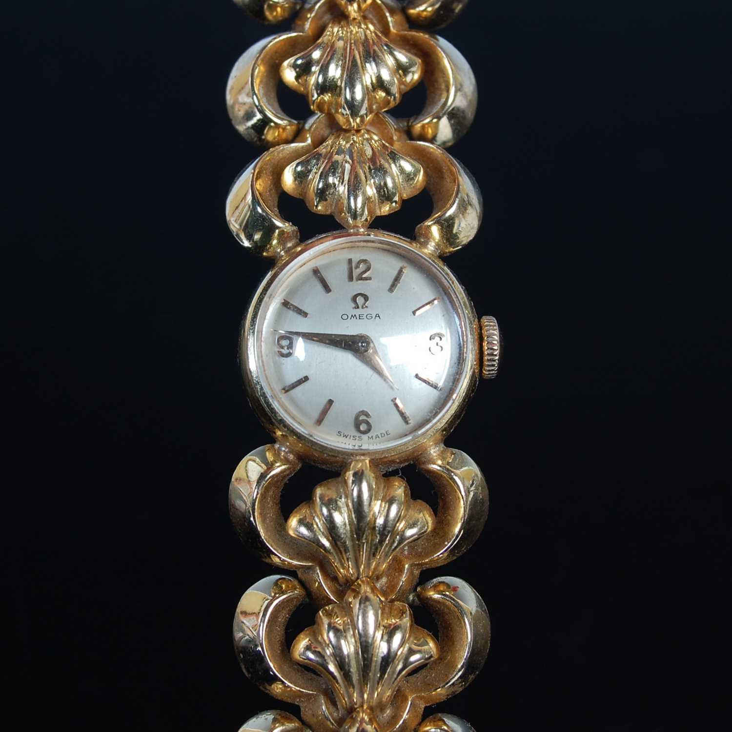 Lot 308 - A ladies 18ct gold bracelet watch by Omega,...