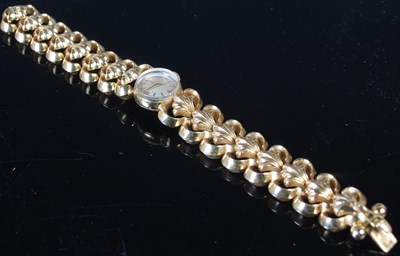 Lot 308 - A ladies 18ct gold bracelet watch by Omega,...