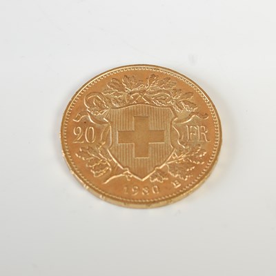 Lot 329 - A Swiss gold 20 Franc coin, dated 1980.