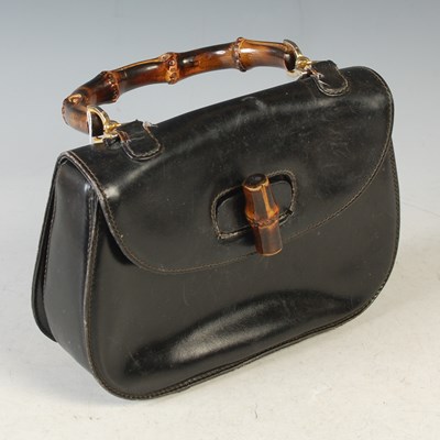 Lot 369 - Gucci, a vintage bamboo handle black leather...