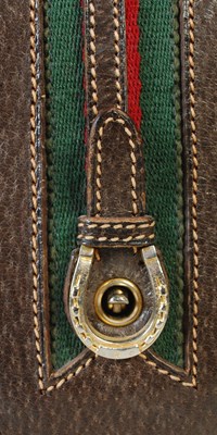 Lot 370 - Gucci, a vintage brown leather handbag with...