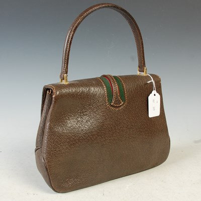 Lot 370 - Gucci, a vintage brown leather handbag with...