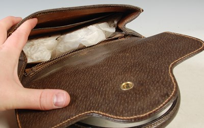 Lot 370 - Gucci, a vintage brown leather handbag with...