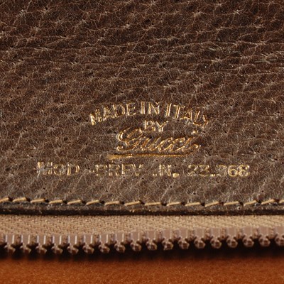 Lot 370 - Gucci, a vintage brown leather handbag with...