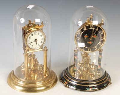 Lot 384 - Two brass dome top mantle clocks; one with...