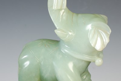 Lot 386 - A Chinese green stone carving of an elephant...