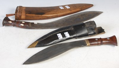 Lot 388 - Two vintage Kukri knives.