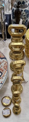 Lot 422 - A graduated set of six W&T Avery brass weights;...