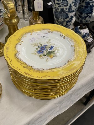 Lot 424 - A set of twelve Coalport yellow ground fruit...