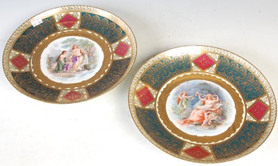 Lot 448 - A pair of Vienna style porcelain chargers,...