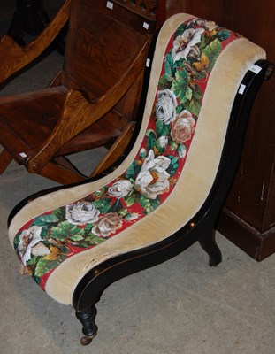 Lot 752 - A 19th century ebonised slipper chair with...