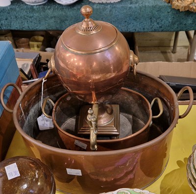 Lot 475 - A copper and brass two handled samovar; two...