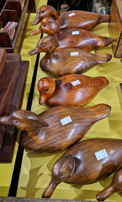 Lot 483 - A collection of seven assorted carved wooden...