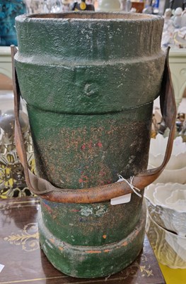 Lot 492 - A green painted artillery shell case household...