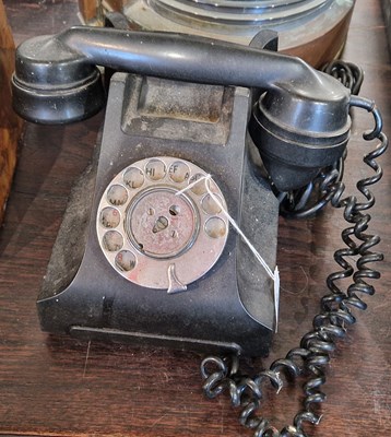 Lot 511 - A vintage rotary dial telephone in black.