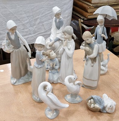 Lot 531 - A collection of nine assorted Lladro, Nao and...