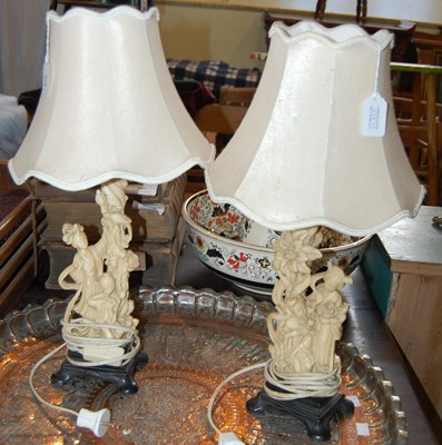 Lot 379 - A pair of faux ivory table lamps and shades