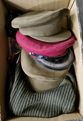 Lot 572 - Two boxes - Military interest clothing to...