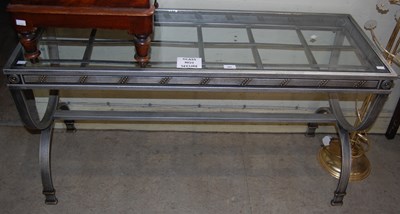 Lot 600 - A metal console table with glass top