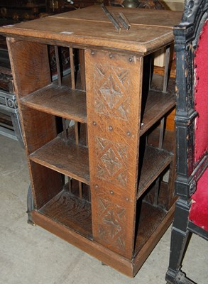 Lot 762 - An early 20th century carved oak revolving...