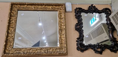 Lot 753 - A giltwood wall mirror with bevelled...