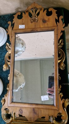 Lot 755 - A walnut fret cut wall mirror of small size...