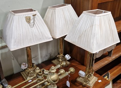 Lot 774 - Three brass Corinthian column table lamps and...