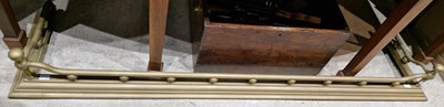 Lot 777 - An early 20th century brass fire curb, 147cm...