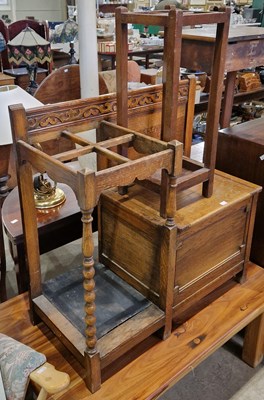 Lot 819 - An oak stick stand / bench, with hinged seat,...