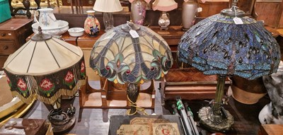 Lot 866 - Two Tiffany style leaded glass table lamps and...