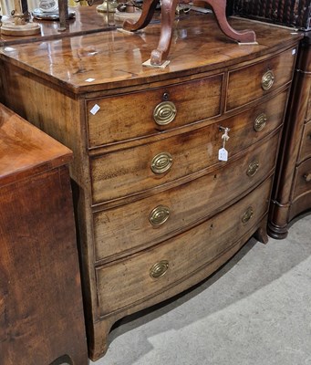 Lot 882 - A George III mahogany bowfront chest with two...