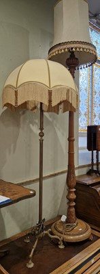 Lot 888 - A carved wood standard lamp and shade, overall...