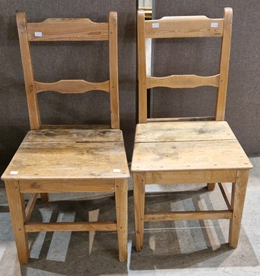 Lot 895 - A pair of country pine kitchen side chairs...