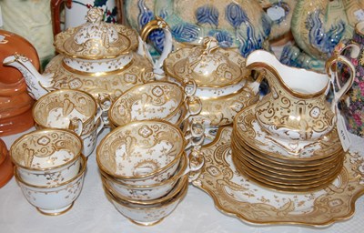 Lot 410 - A 19th century white, ochre and gilt part tea set